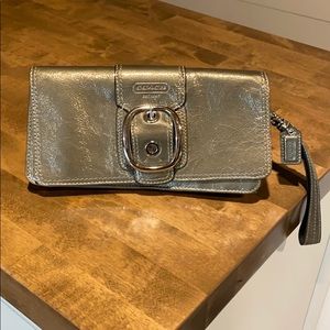Coach clutch purse in patent leather silver